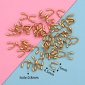 Macro shot of 4.5mm golden stainless steel U-shape wire protectors for DIY jewelry - Small Vacuum Gold (4.5x5)