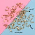 Macro detail of gold stainless steel U-shaped wire guards in 5mm and 6mm sizes - Large Vacuum Gold (5x6)