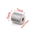 Macro view of 6x7mm stainless steel mesh textured tube bead with 2mm hole for DIY jewelry - 6x7x2 Spiral Pattern / Steel