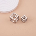 Detailed view of polished stainless steel hollow cube pendants in two sizes for DIY jewelry - 15mm / Steel