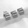 Trois boucles d'oreilles clips en acier argenté avec étoiles gravées et cristaux - Acier - Étoile