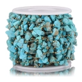 Detailed macro of turquoise gemstone beads on a gold chain for DIY jewelry making - Gold-Sky Blue
