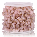Detail of pink crystal chips with gold beads on a spool for DIY jewelry chain - Gold-Pink