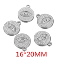 Detail view of five 16x20mm stainless steel evil eye sun relief pendants for DIY jewelry - Small / Steel