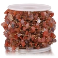 Handmade gold beaded chain with irregular red agate stone chips on white spool - Gold-Brick Red