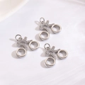 Detailed close-up of three bicycle pendants with pavé-set zircons for DIY jewelry making - Bicycle Charm / Steel Color Bicycle