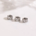 Macro shot of silver plated flower spacer beads with micro-pave cubic zirconia stones - Hollow Wave Petal Style Silver (ZYN-DMK1250P)