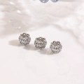 Detailed macro of three silver-plated hollow beads with pavé zircon stones for DIY jewelry - Hollow Floral Transfer Bead Silver (ZYN-DMK1251P)