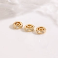 Detailed macro view of 18K gold-plated spacer beads with inlaid clear cubic zirconia - Twill Gear Inlaid Spacer Bead Rose Gold (ZYN-DMK1264KCG)