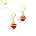 Detailed macro of gold plated sacred heart earrings with red gemstone and cross accent - Thorns Cross Style (ZYN-DME801G)