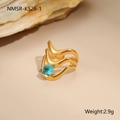 Macro detail of 18K gold plated stainless steel ring with 0.6cm blue zircon stone - Triple Wave Round Stone (NMSR-K526-1)