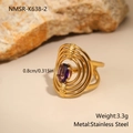 Close-up of gold irregular stainless steel ring with oval purple zircon inlay and specs - Multi-Layer Nested Rings (NMSR-K638-2)