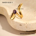 Detailed macro view of an irregular gold stainless steel ring with a purple zircon gem - Organic Form Wave (NMSR-K638-3)