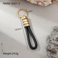 Detail view of woven leather keychain with gold metal ring and 10.5cm length markings - Black Gold Striped Style (NMSK-G421-3)