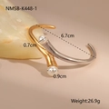 Detail view of two-tone stainless steel open bangle with elegant white pearls - Gold & Silver Two-Tone Fork Pearl Style (NMSB-K448-1)