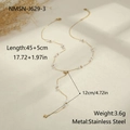 Detail view of gold Y-shaped stainless steel necklace with faux pearls and star pendant - Star Pearl Y-Chain (NMSN-J629-3) / Gold