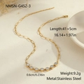 Detailed view of gold paperclip chain necklace with clear cubic zirconia heart pendants - Round Zirconia Necklace (NMSN-G452-3)