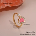 Close-up of golden adjustable heart ring with pink fill and crystals on pink mineral - Pink Enamel Rhinestone Heart Gold Style (NMSR-J743-3)