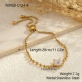 Detail of adjustable stainless steel slider bracelet with a sparkling star zircon pendant - 18K Gold / Star (NMSB-L124-4)
