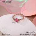 Detailed macro view of pink beaded elastic ring with gold stainless steel spacers - Pink Faceted Bead Style (NMSR-K722-3)