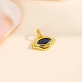 Detailed close-up of 18k gold plated evil eye lip pendant with blue cubic zirconia stones - Blue