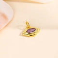 Macro detail of eye-shaped 18k gold plated pendant with purple marquise zircon stone - Purple