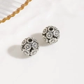Macro detail of 10mm antique silver hollow flower beads for DIY jewelry making - Antique Silver Flower Pattern