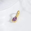 Macro shot of a purple teardrop zircon pendant with 18k gold plating for jewelry DIY - Purple Water Drop Style (ZYN-DMK884G-7)