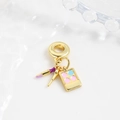Macro detail of copper makeup charms featuring purple lipstick and eye shadow palette - Purple Lipstick Eyeshadow Brush Style (ZYN-DMK898G-2)