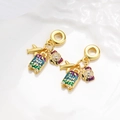 Golden travel charms featuring a plane, camera, and 'Just go!' suitcase with enamel - Plane Suitcase Camera Travel Set (ZYN-DMK993G-1)
