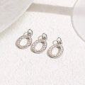 Macro view of three silver heart oval pendants with woven texture for DIY jewelry making - Silver Rhombus Grid Oval (ZYN-DMK1023P)