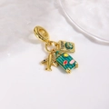 Detailed view of travel charms including a green enamel suitcase and gold passport pendant - Green Suitcase Travel Set (ZYN-DMK1070G-1)