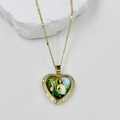 Detailed close-up of a gold heart pendant with zircon inlay and St. Jude religious icon - Saint Jude Style (DMK1151G-9A)