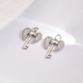 Detail of silver angel wing heart key pendants with sparkling white cubic zirconia - White Heart Key