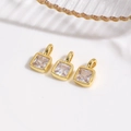 Macro shot of 18k gold plated square cubic zirconia charms for DIY jewelry making - White