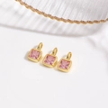 Close-up of square gold pendant with princess-cut pink zircon for jewelry making - Pink