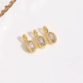 Detalle de tres colgantes ovalados de circón dorado para la creación de joyas DIY - Colgante Blanco / Solo colgante