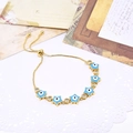 Detail of adjustable star evil eye bracelet with blue enamel and cubic zirconia charms - Deep Blue Star