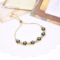 Adjustable gold plated evil eye star bracelet with zircon inlay on vintage postcard - Black Rhinestone Star