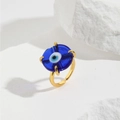 Adjustable gold evil eye ring with blue glass charm on white aesthetic background - Dark Blue (ZYN-DMR146G-5)