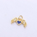 Detail of a golden bat wing heart pendant with blue enamel and zircon stones - Purple Gold Wing Heart