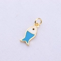 Macro view of a gold plated cartoon fish pendant with blue and white enamel details - Blue Goldfish