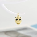 Macro view of a gold owl pendant with intricate textures and black gemstone eyes - Pendant Only / Gold-Black Eye