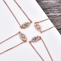 Rose gold Evil Eye connector pendants with opal and zircon in four varied colors - Blue Opal / Rose Gold Eye Bracelet