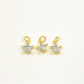 Macro view of three gold pentagram pendants with cubic zirconia for DIY jewelry making - Clear Star Pendants Set