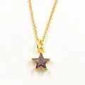 Detail of a purple star-shaped pendant on a fine golden chain necklace for women - Purple Star Necklace