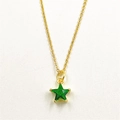 Macro detail of a green star pendant with micro-set zircon and a gold-plated copper chain - Green Star Necklace