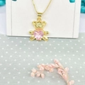 Close-up of golden panda pendant holding a pink heart crystal on a dainty box chain - Necklace Set (ZYN-DMK482G-4) / Pink