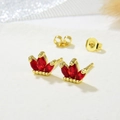 Macro shot of gold crown earrings with three red marquise-cut cubic zirconia and butterfly backs - Red Style (ZYN-DME247G-3)