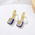 Detailed close-up of gold geometric earrings with blue enamel and sparkling zircon stones - Royal Blue (E240+K475G-4)